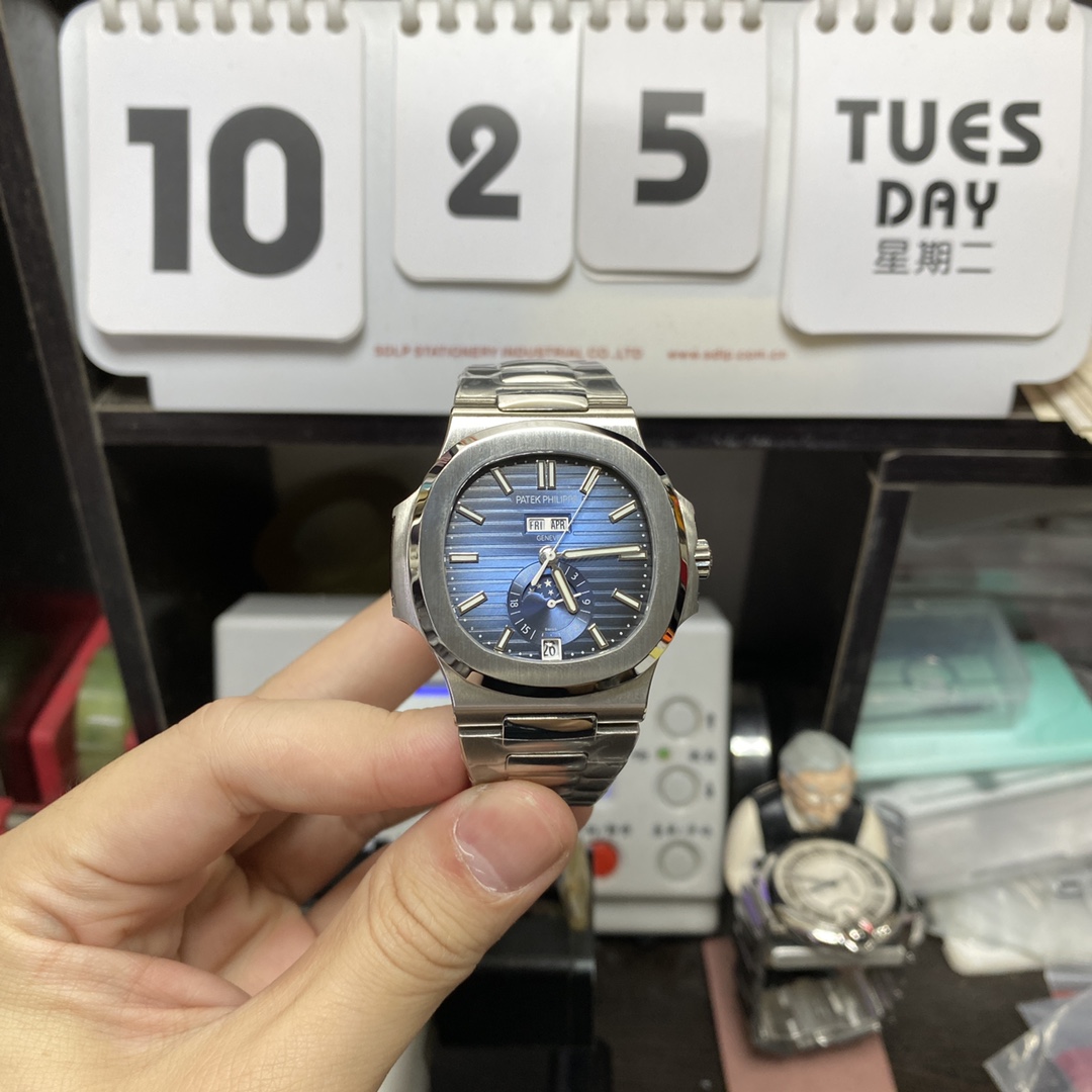 Patek Philippe Nautilus series 57261A-014, Blue Dial Steel Bracelet, Moon Phase Calendar Central Month and Week Display, 40.5mm Size.