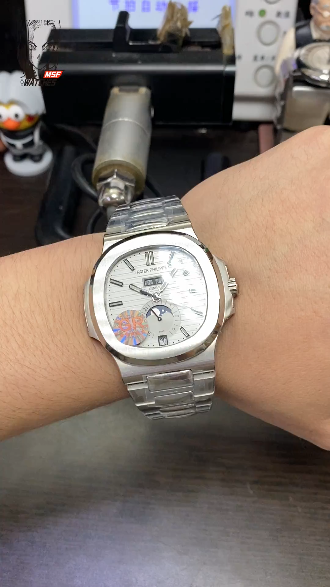 Patek Philippe Nautilus series 57261A-010, White Dial, Complete Month Day Date and Moon Phase Functions, 40.5mm Size.