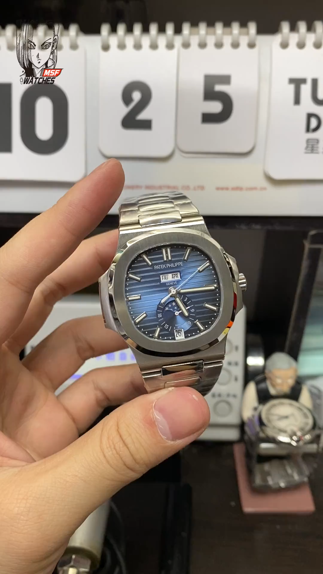 Patek Philippe Nautilus series 57261A-014, Blue Dial Steel Bracelet, Moon Phase Calendar Central Month and Week Display, 40.5mm Size.