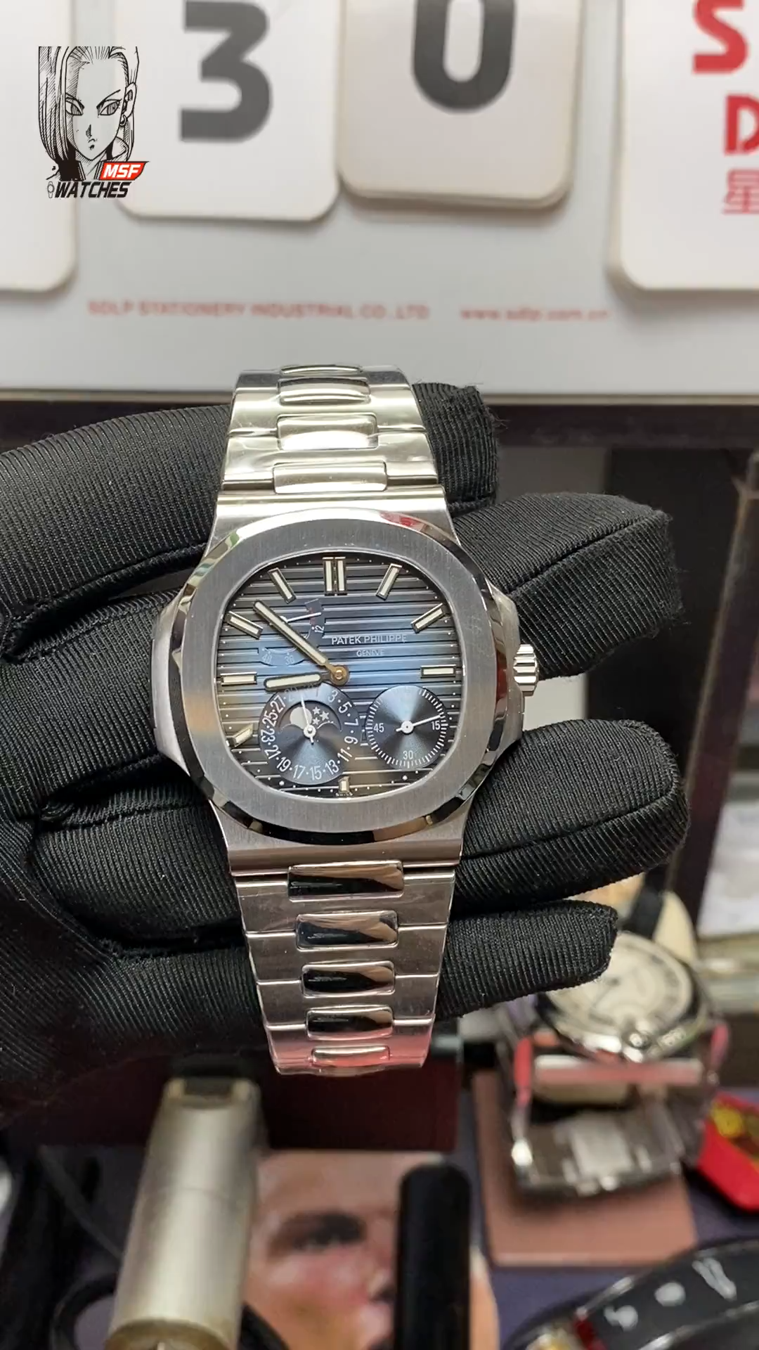 Patek Philippe Nautilus series 57121A-001, Blue Dial Steel Bracelet, Synchronized Functions, 40mm size.