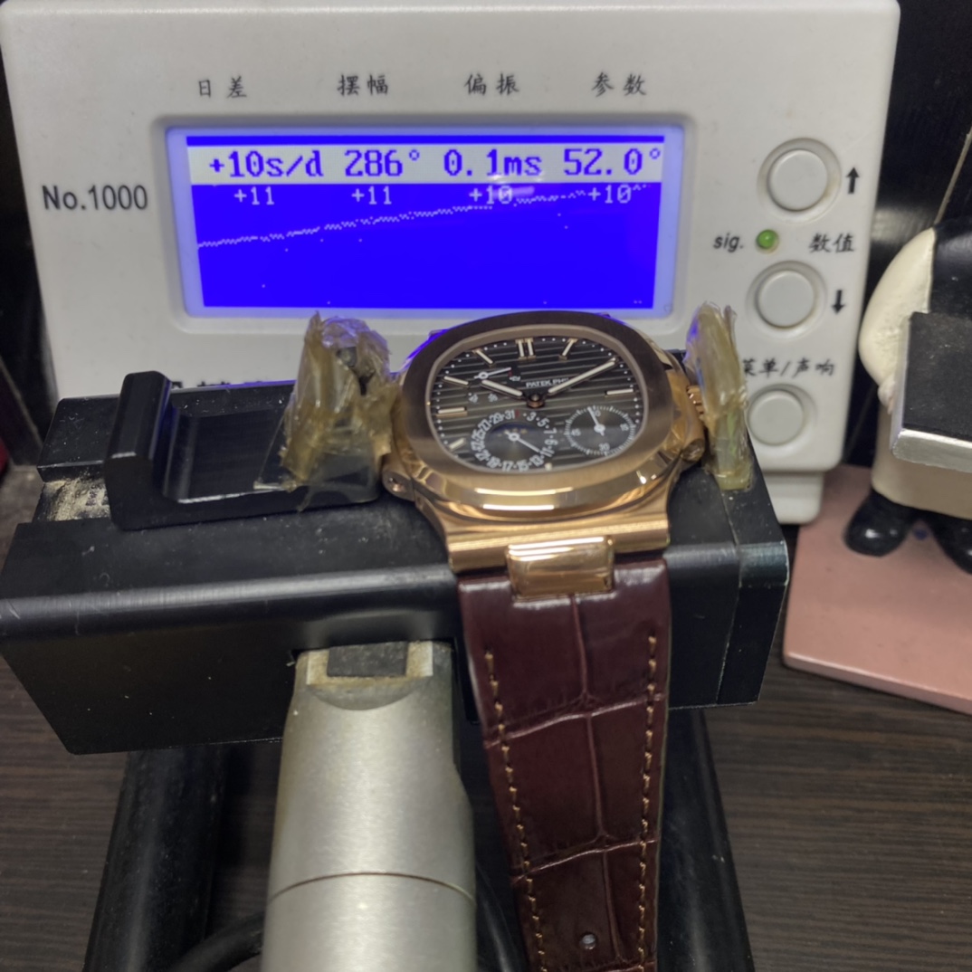 Patek Philippe Nautilus series 5712GR-001, Coffee Dial Rose Gold Case Brown Leather Strap, 40mm size.