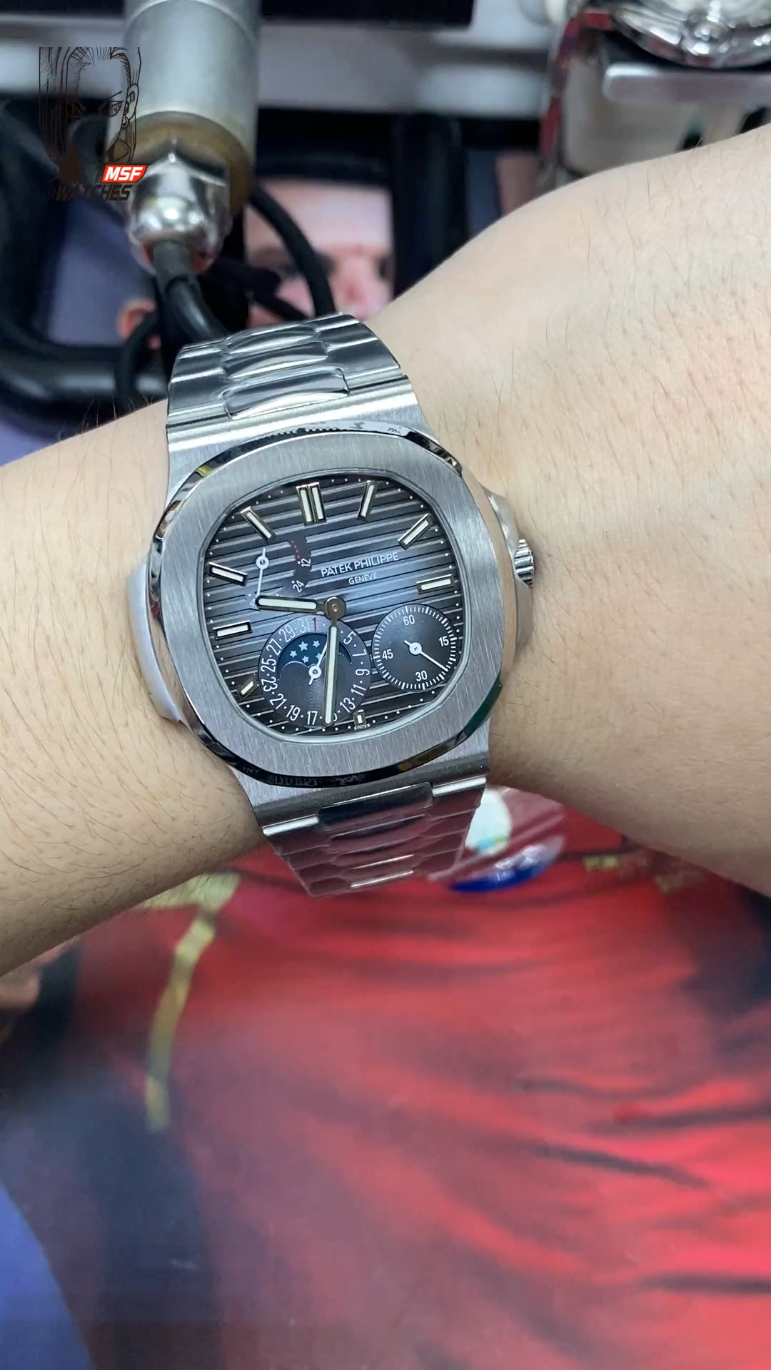 Patek Philippe Nautilus series 57121A-001, Blue Dial Steel Bracelet, Synchronized Functions, 40mm size.