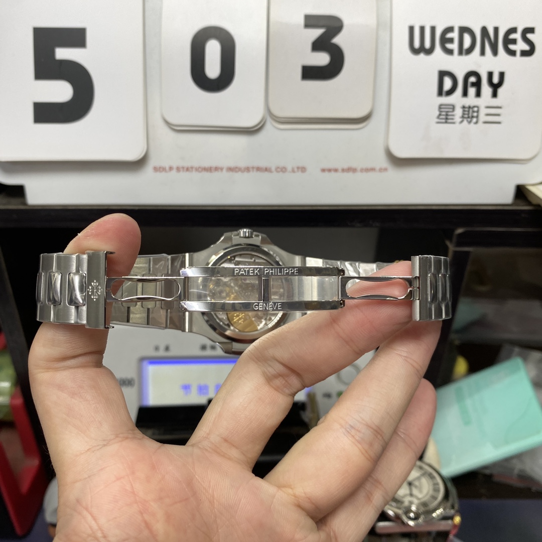 Patek Philippe Nautilus series 57121A-001, Blue Dial Steel Bracelet, Synchronized Functions, 40mm size.