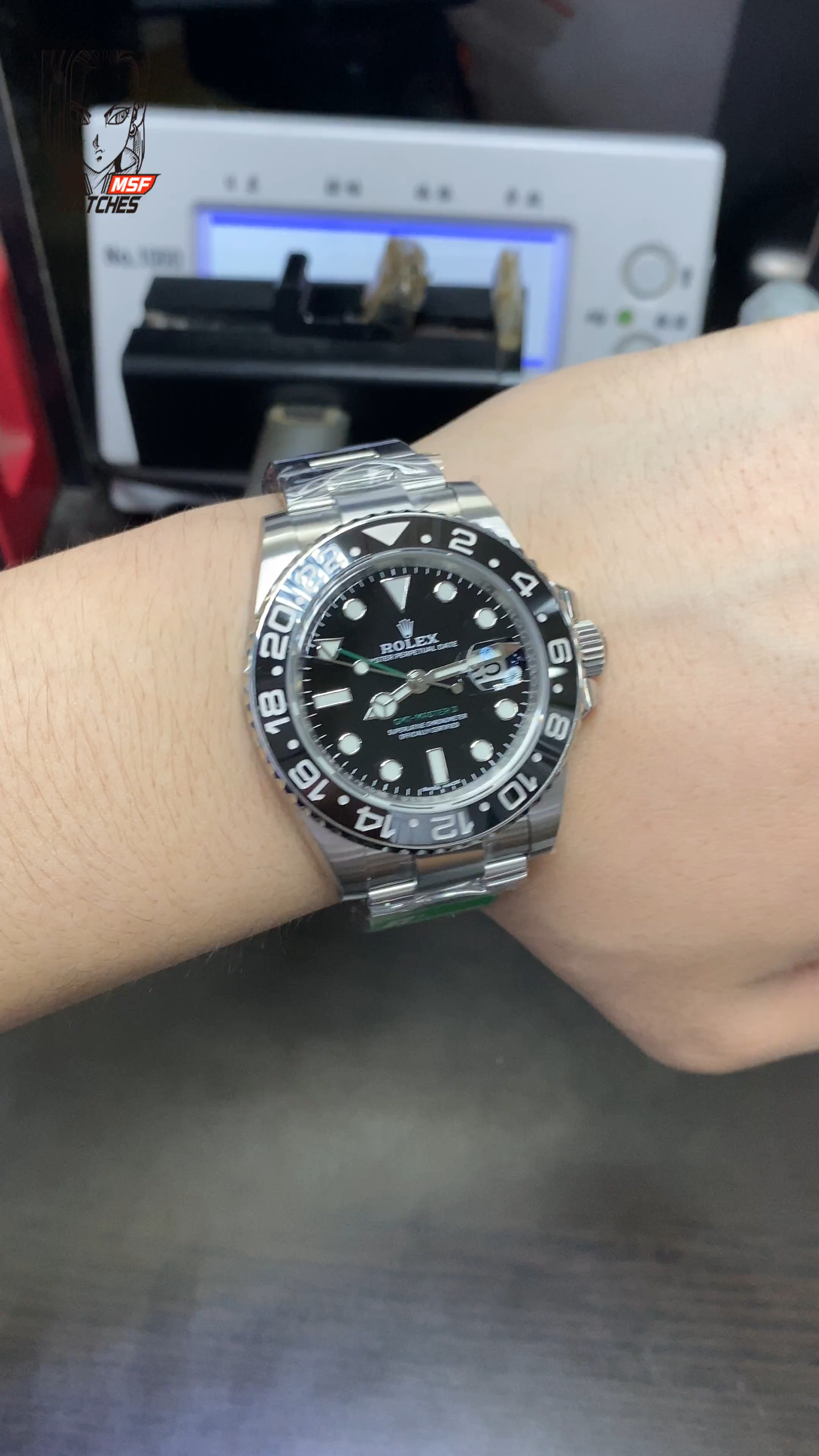 Rolex GMT-Master II series 116710LN-0001, All-Black Bezel Black Dial Green Hands, 40mm Size.