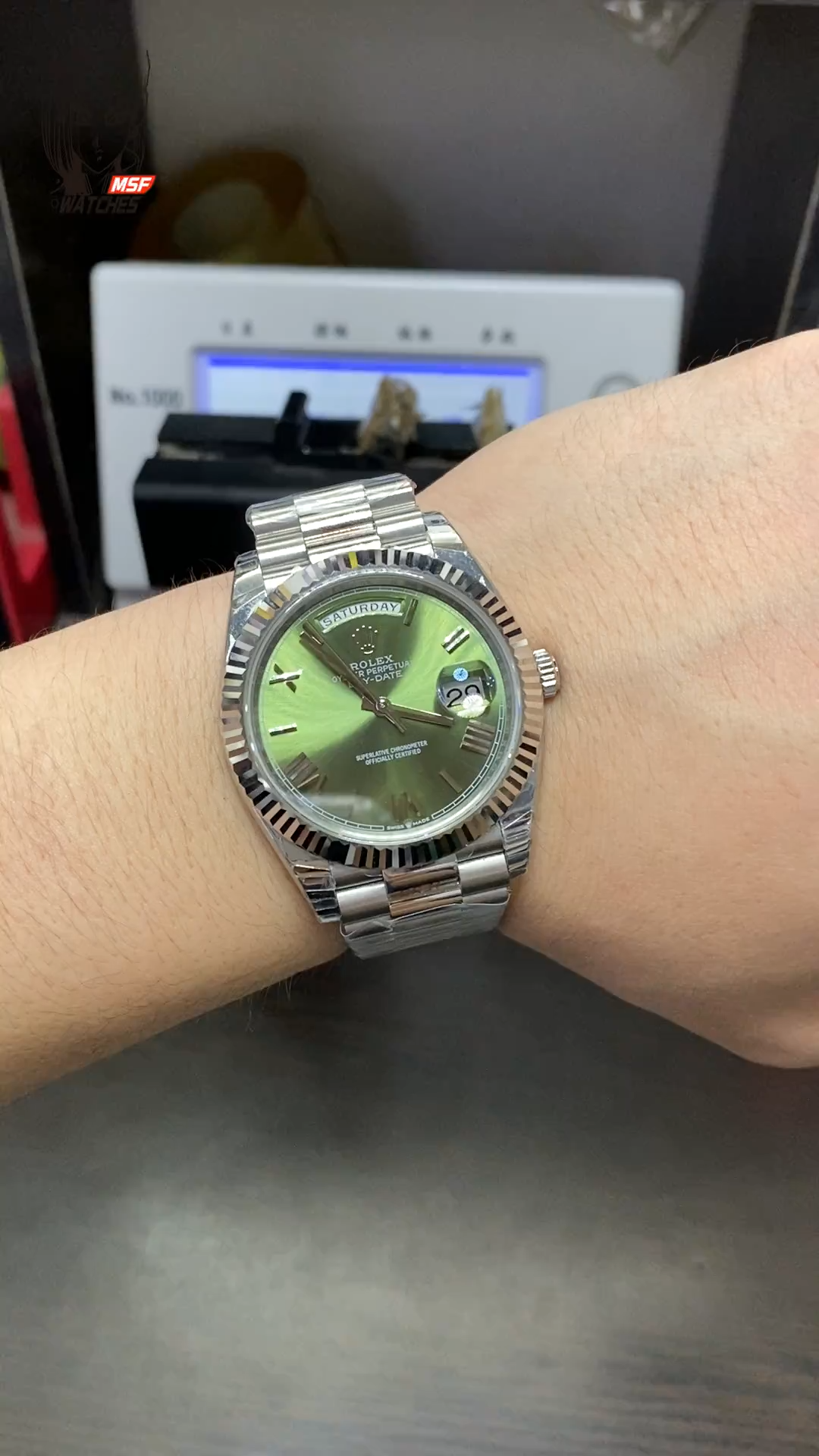 Rolex Day-Date series m228239-0033, Silver Case Olive Green Dial with Roman Numeral Markers, Instantaneous Day and Date Functions, 40mm Size.