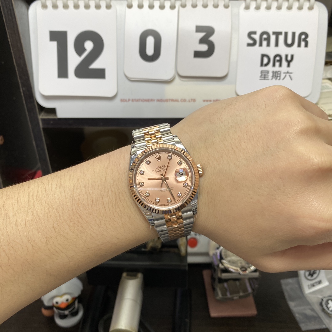 Rolex Datejust Series m126331-0008, Pink Dial with Checkered Bezel Two-Tone Rose Gold Case, 36mm Size, Five-Link Steel Bracelet.