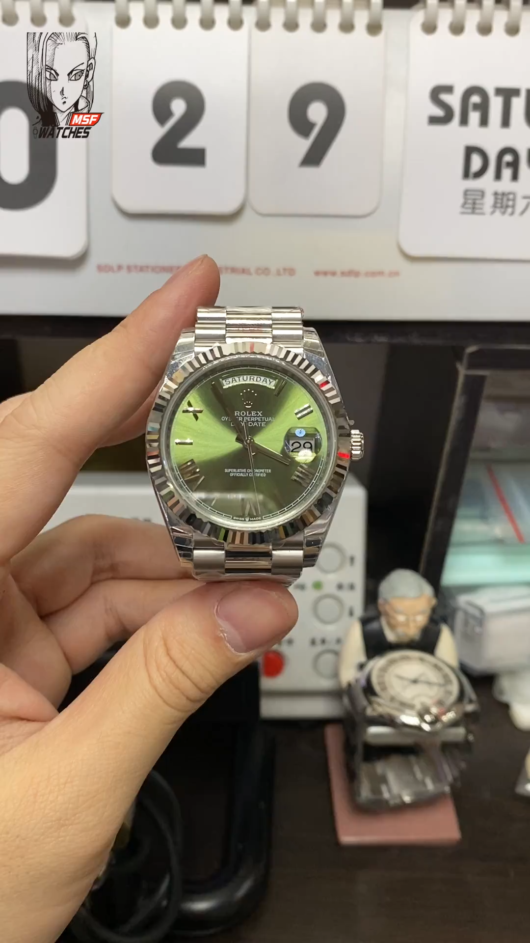 Rolex Day-Date series m228239-0033, Silver Case Olive Green Dial with Roman Numeral Markers, Instantaneous Day and Date Functions, 40mm Size.