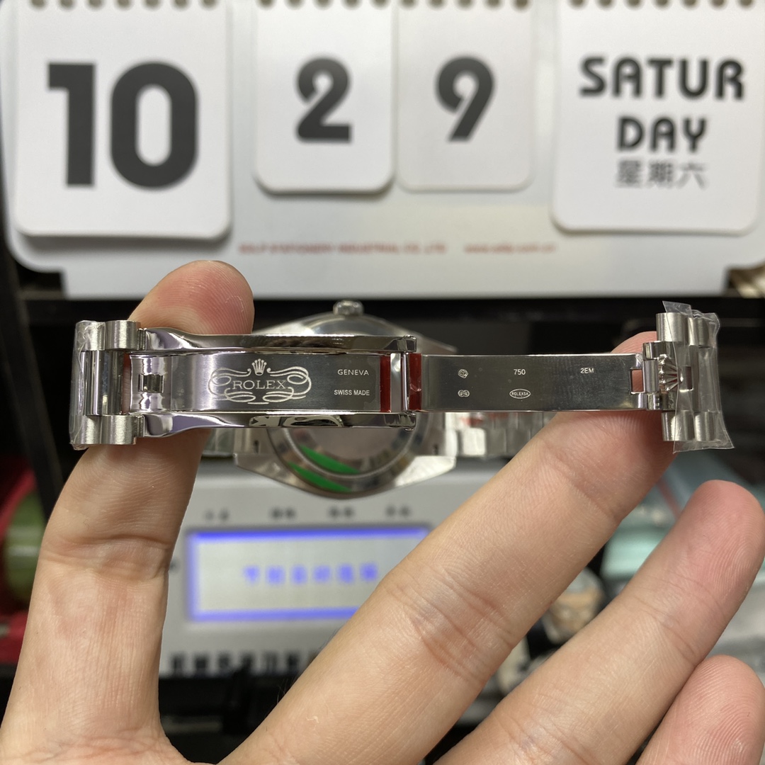 Rolex Day-Date series m228239-0033, Silver Case Olive Green Dial with Roman Numeral Markers, Instantaneous Day and Date Functions, 40mm Size.